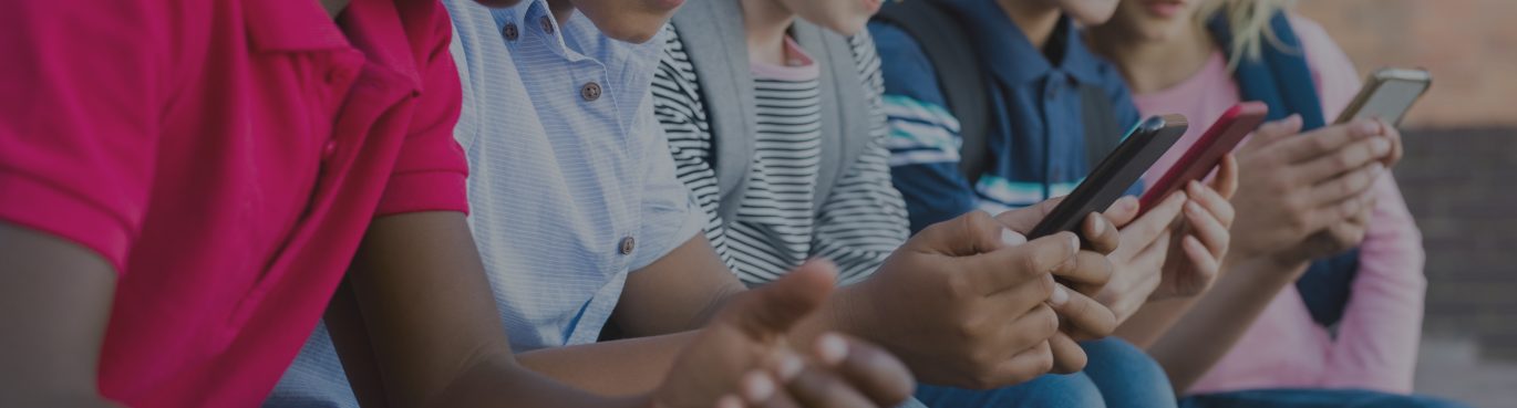 Children on smart phones talking about sexting and pornography